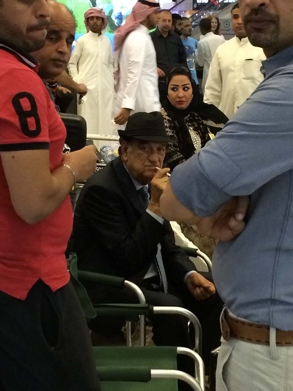 mayhem in kuwait airport. confetti, balloons being popped, bright lights...and this egyptian actor. they were filming a series. i don't think this guy's too happy he's being photographed by a crazy chick in black