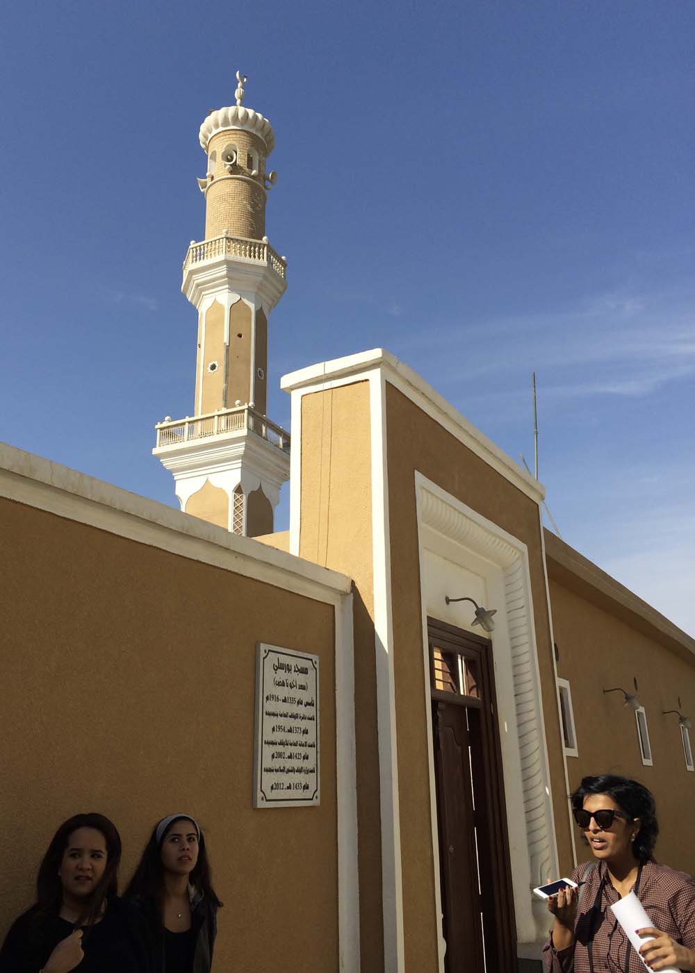 tour guide deema al-ghunaim in front of bourisly mosque, built in 1916