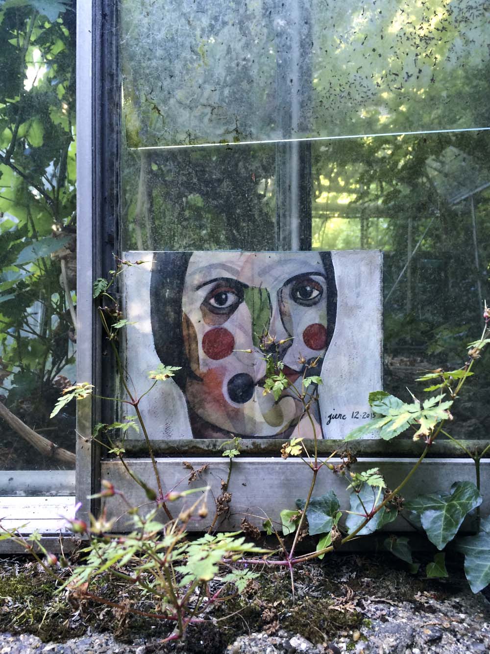 the third greenhouse is the emptiest and the most overgrown. this one resists leaving. she hides in between the panels but i finally manage to wrest her from the panes