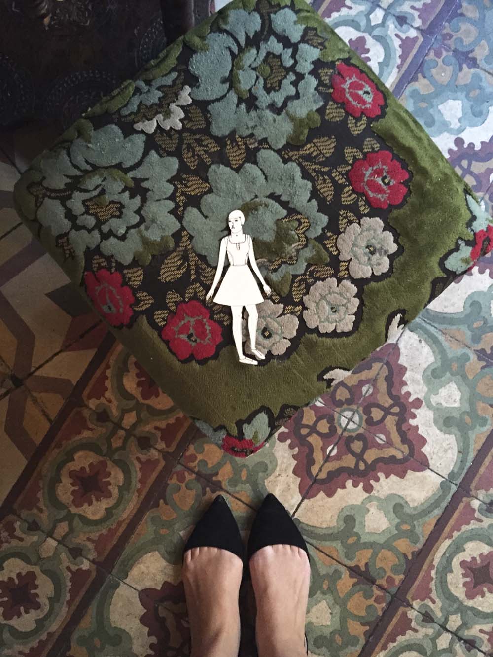 eve is in love with the floral motifs on the furniture and floor tiles